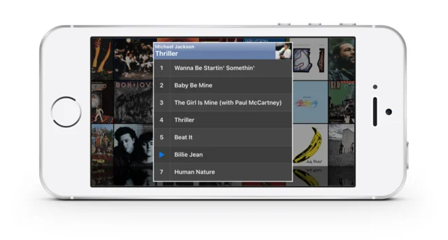 Medley in landscape, showing a wall of album covers with one album’s track list overlaid.