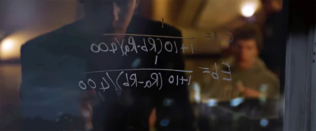 A blurry film still of someone writing a long formula on a glass window.